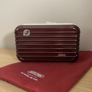 Brand new burgundy Rimowa Travel Amenity Kit